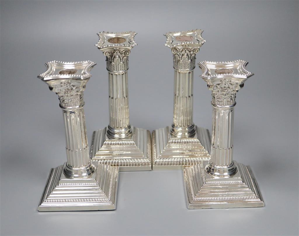Two pairs of silver corinthian column dwarf candlesticks, Sheffield, 1920 and Sheffield, 1962, 17cm & 16cm.